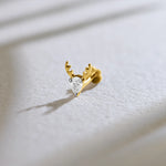 Lab grown diamond nose pin with heart shaped diamond and antler gold design on soft background
