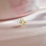 14k gold daisy-style stud earring featuring pear-shaped diamond petals and round center stone