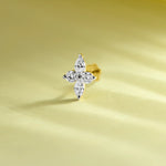 Trending gold nose pin with floral diamond design on soft pastel background