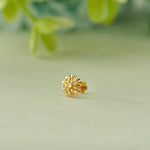 Geometric flower-shaped gold stud earring with diamond cutout petals, no gemstone