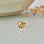 Gold stud earring with open lattice flower design