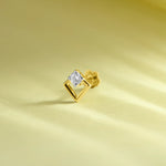 Gold geometric diamond nose pin design on soft pastel background