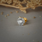 Stone Gold Nose Pin with a round cluster design featuring multiple sparkling stones set in gold on a soft neutral background