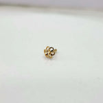 Front view of floral gold nose pin on a white background showing its compact size and detailing