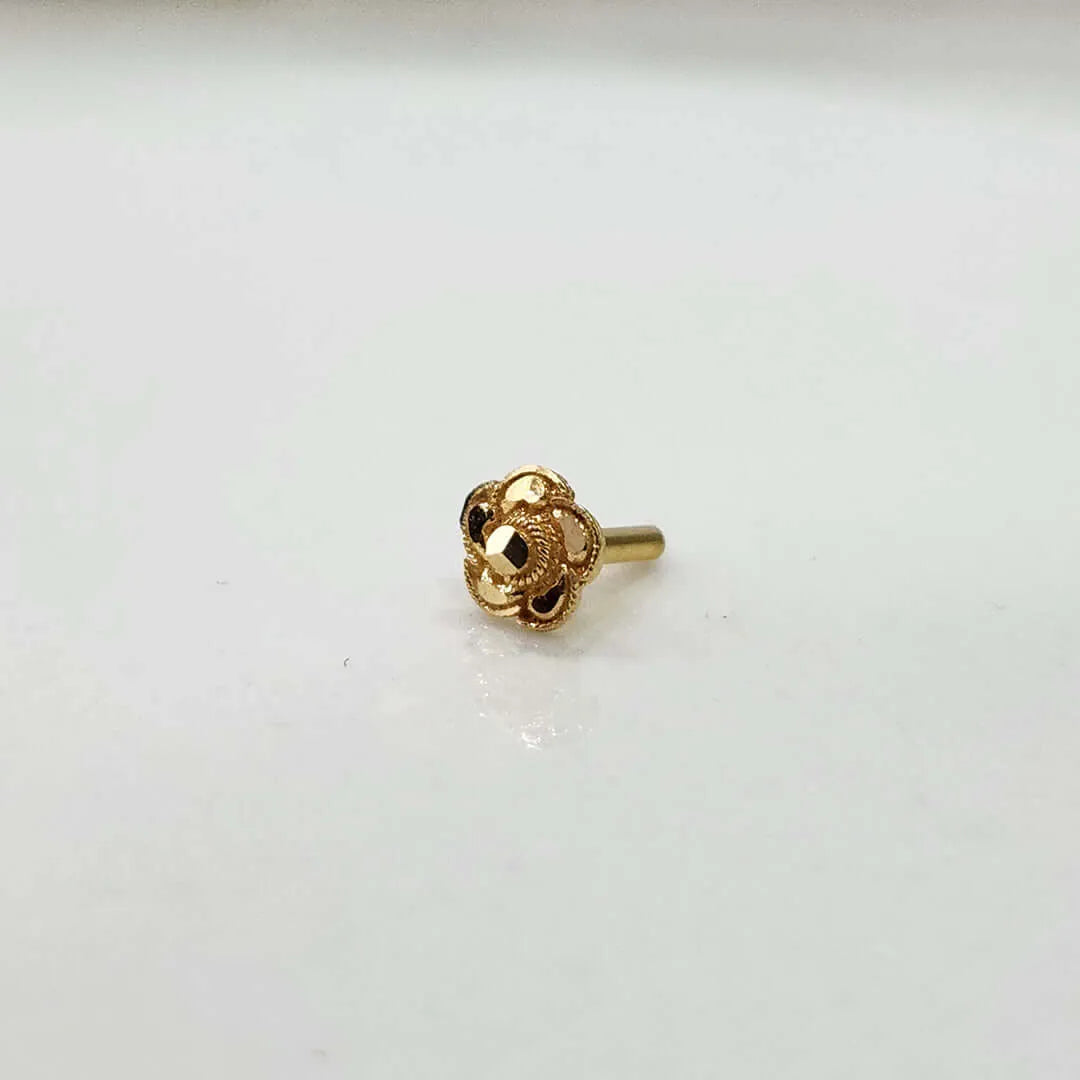 Front view of a floral gold nose pin on a clean white background showcasing its size and detailed craftsmanship