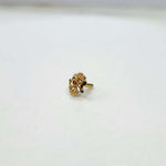 Side angle of the gold nose pin on a white background showing subtle detailing and smooth finish