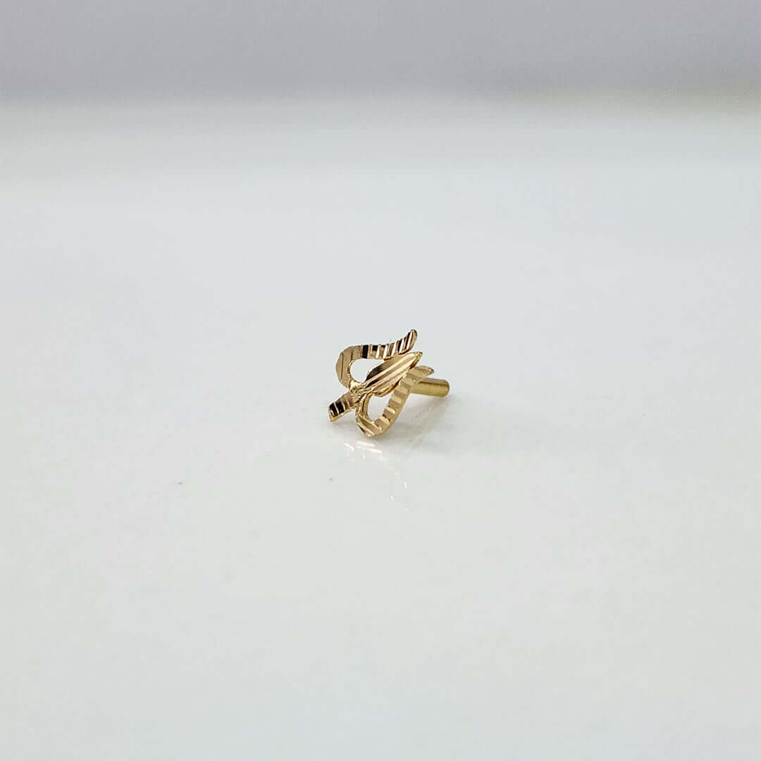 Close-up view of an elegant 18K gold twisted nose pin placed on a white background showcasing its sleek, modern design