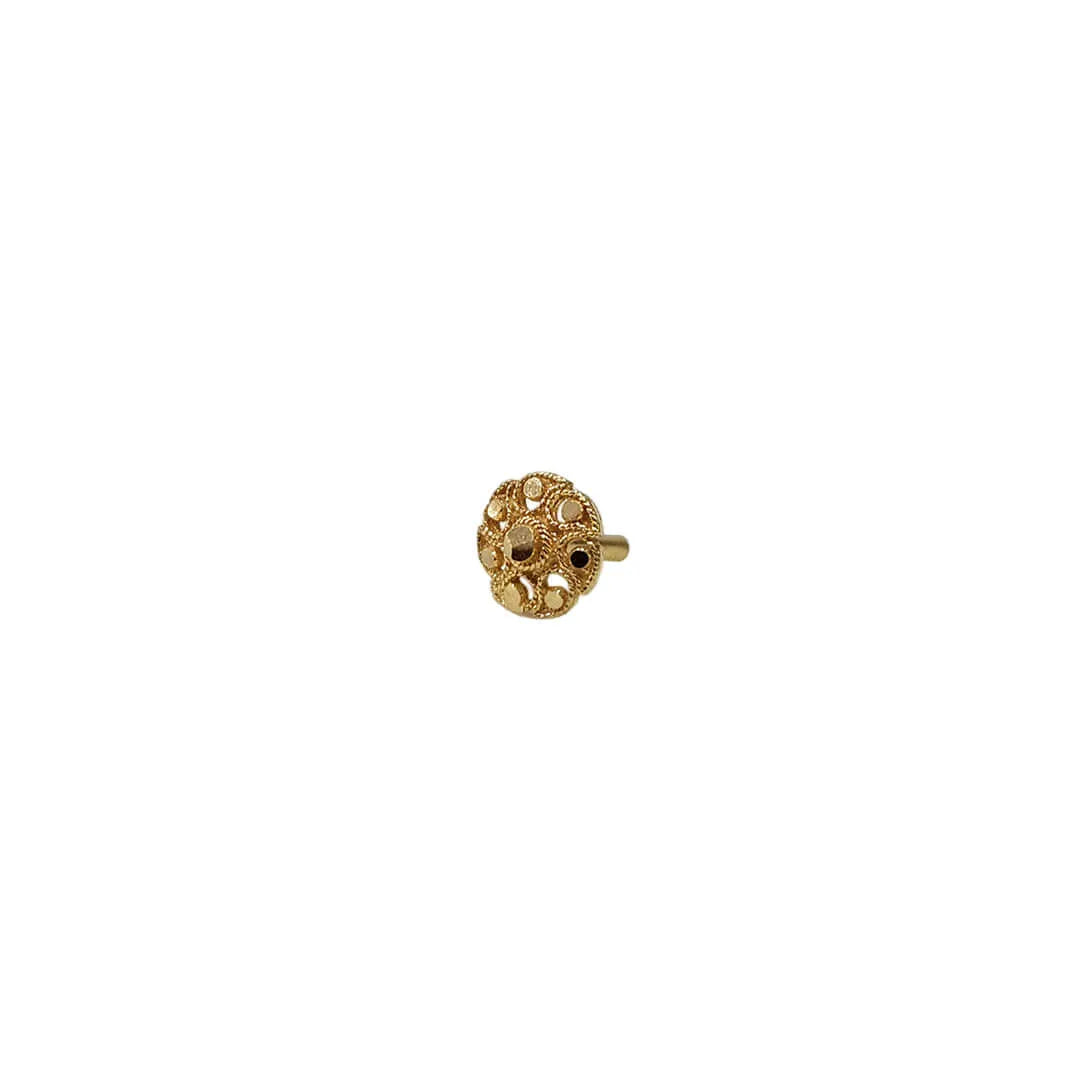 Front view of a small floral gold nose pin design on a white background showing its compact size and detailed finish