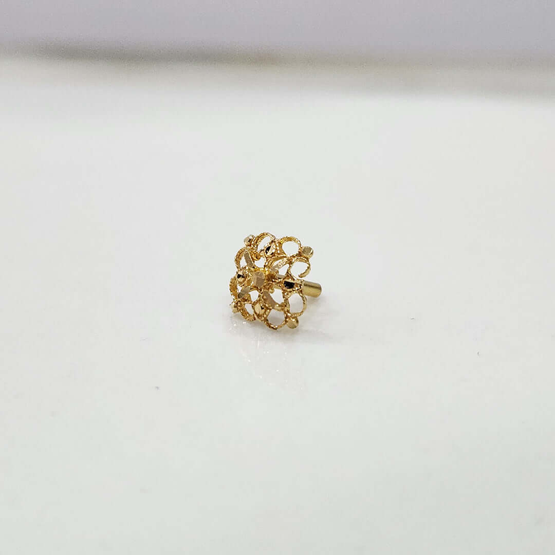 Front view of tiny lattice-pattern 18K nose pin gold placed on a soft white background highlighting its fine detailing