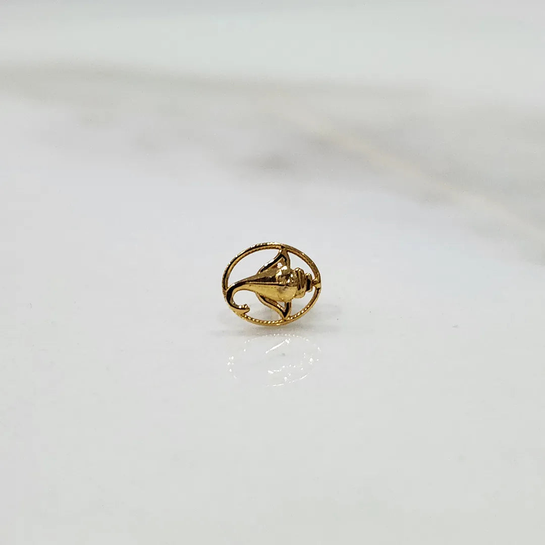 Close up of handcrafted floral gold nose pin design on white background ideal for elegant daily wear