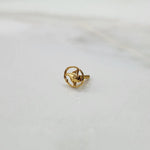 Side view of 18k gold floral nose pin design featuring refined petal detailing and polished finish