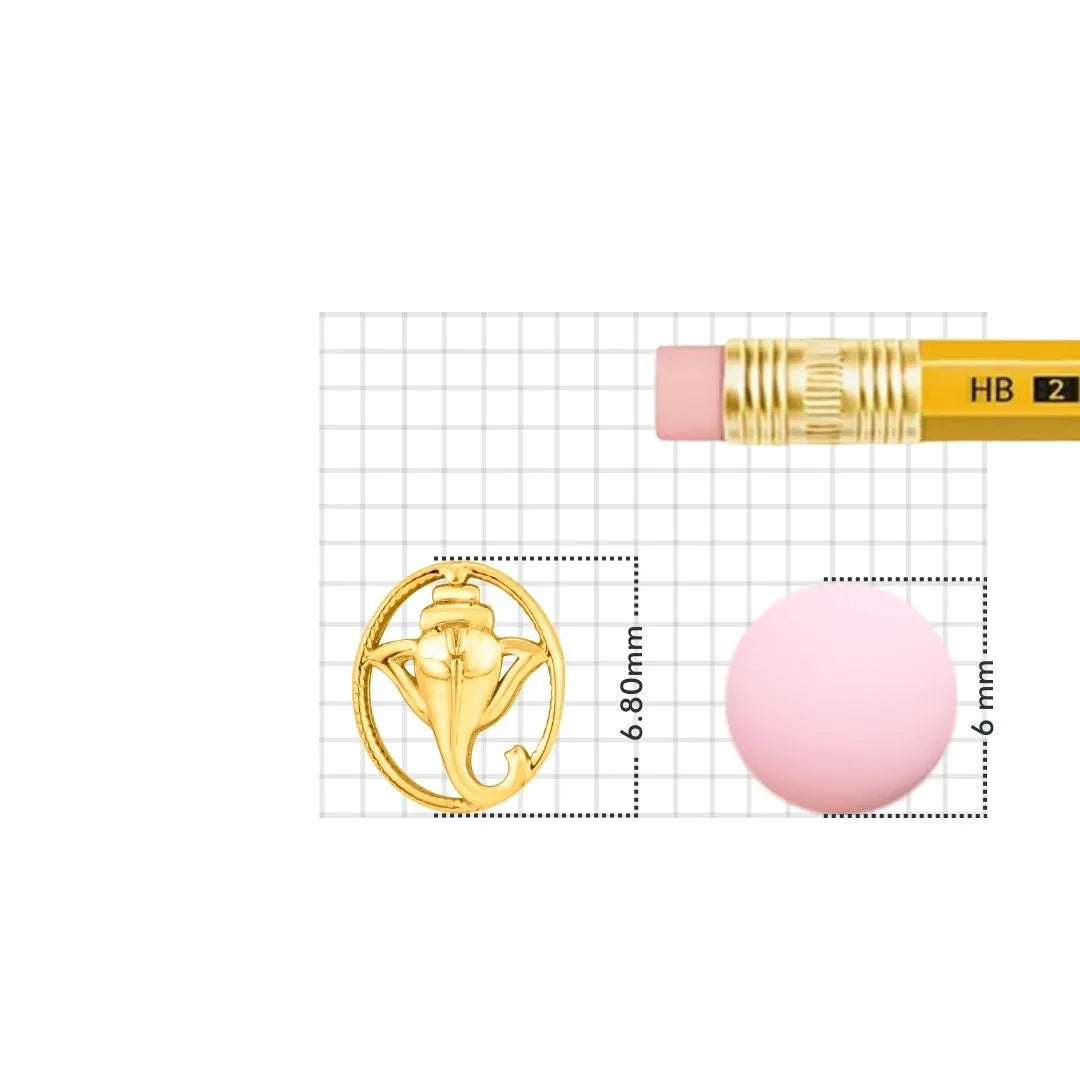 Gold nose pin displayed beside pencil for size comparison highlighting delicate handcrafted detailing
