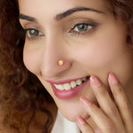 Front view of geometric hexagon cutwork 18K gold nose pin on a white background highlighting intricate pattern detailing