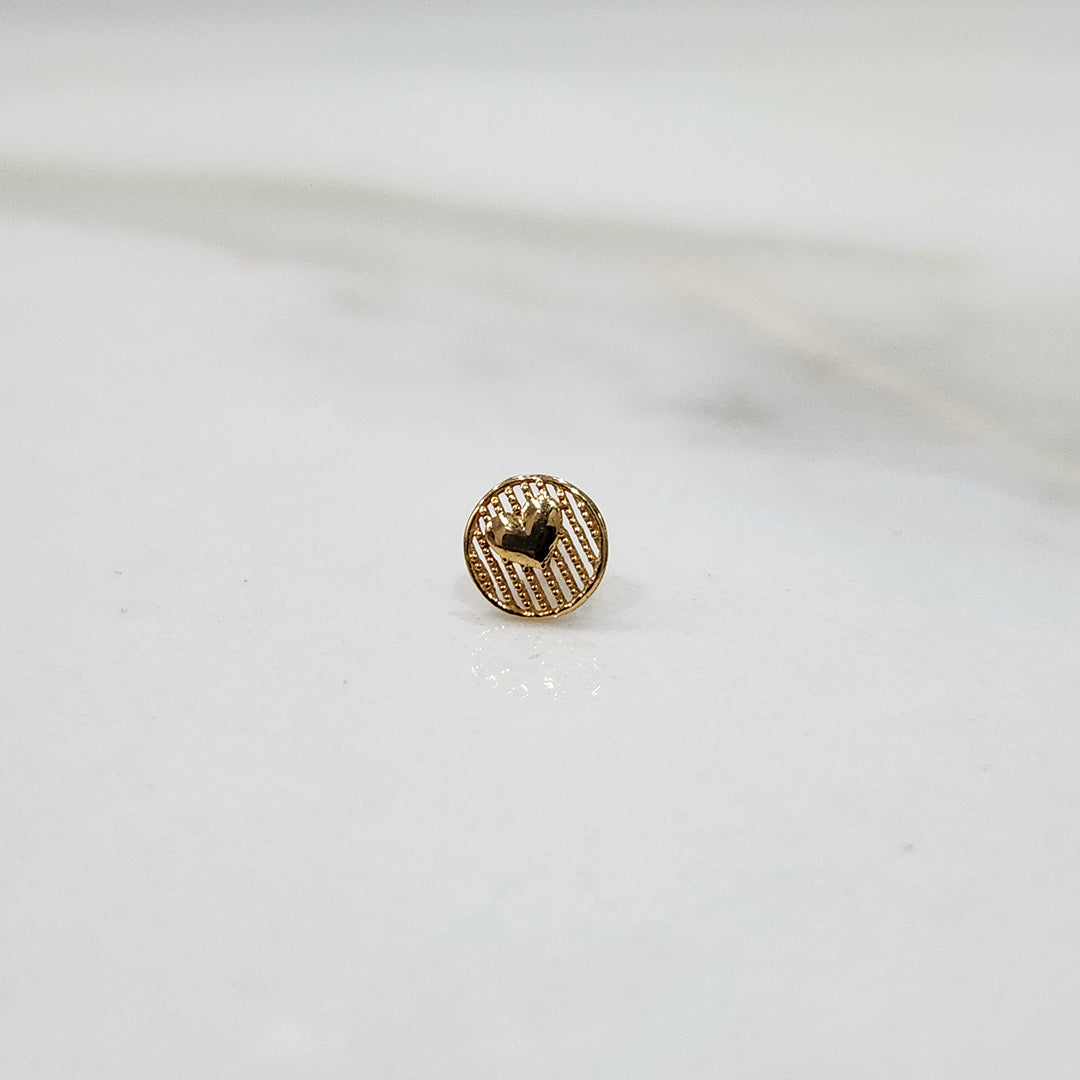 Close up of heart pattern gold nose pin design on white background ideal for elegant modern women