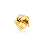 Small floral gold nose pin design displayed in close-up on white background