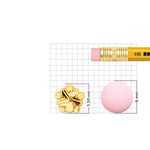 18k gold flower nose pin size guide showing 5.50 mm height and 6 mm width with grid and pencil for scale reference