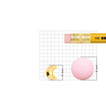 Crescent gold nose pin shown beside pencil for accurate size reference and dimensions