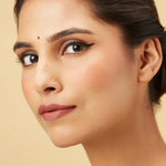 Model wearing crescent gold nose Model wearing crescent gold nose pin showing elegant fit and refined detailing
