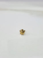 Front view of a small gold nose pin on a white background showing compact size and clean detailing