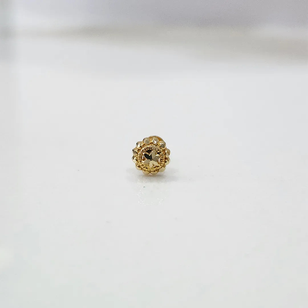 Tiny floral 18K nose pin gold displayed on a clean white background showing its detailed design