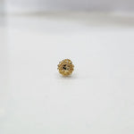 Tiny floral 18K nose pin gold displayed on a clean white background showing its detailed design