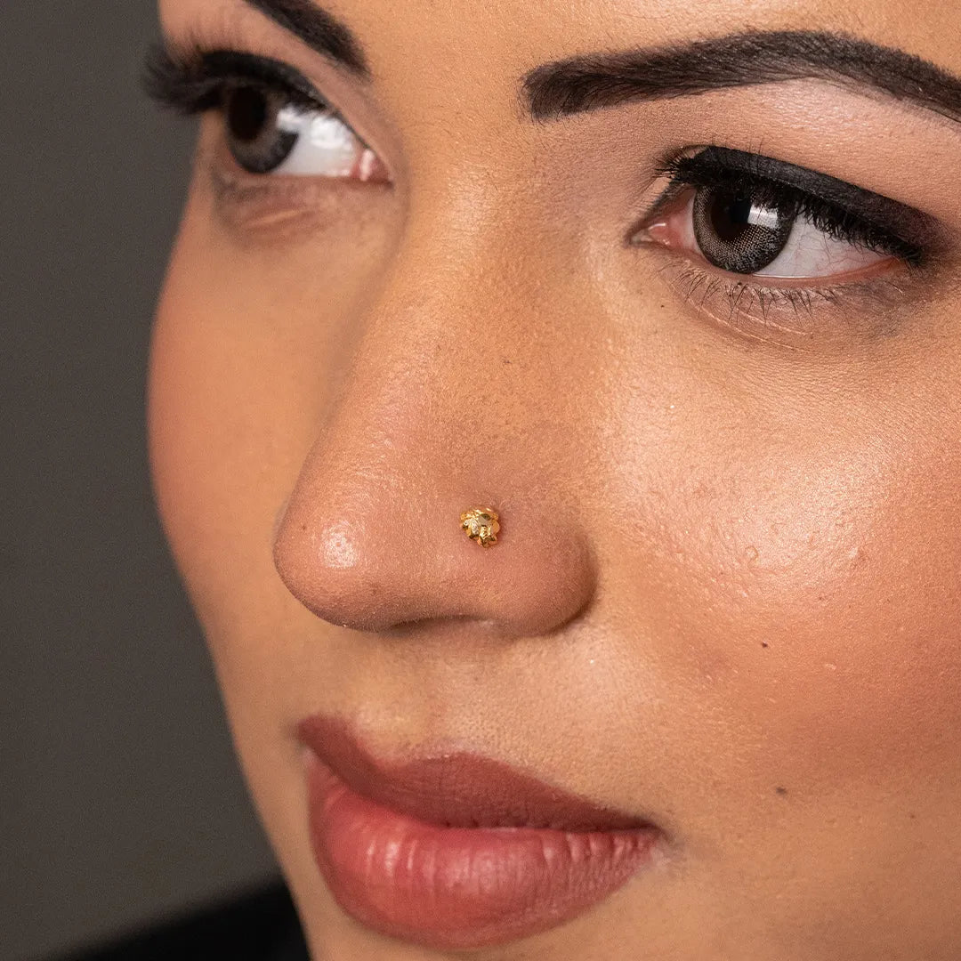 Woman wearing a delicate 18K nose pin gold showcasing an elegant everyday ethnic look