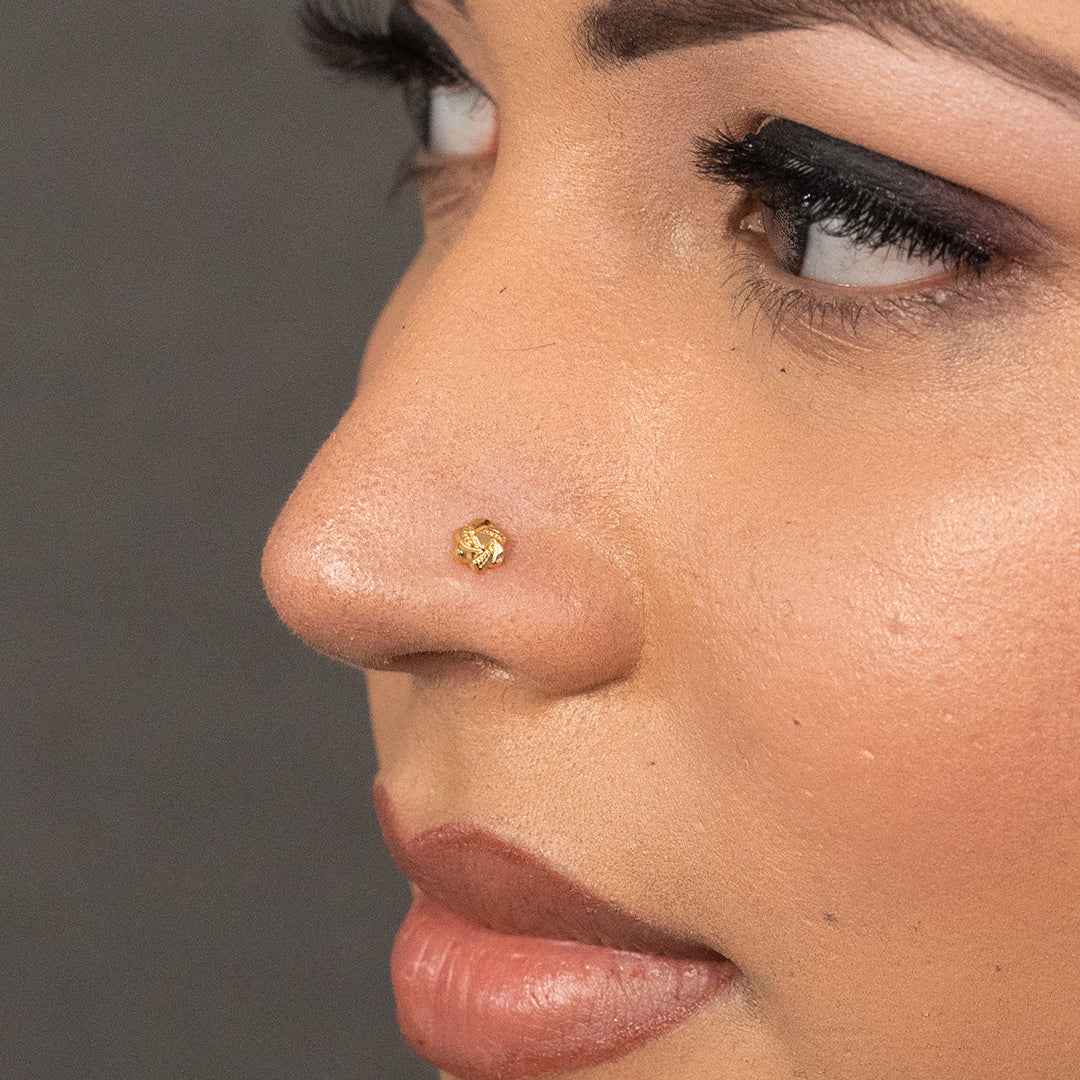 Model view of woman wearing a delicate 18K nose pin gold showcasing a minimal and elegant everyday look