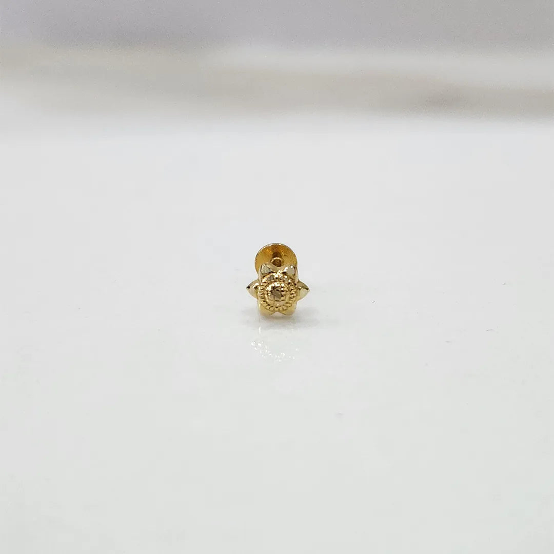 Side view of delicate 18K nose pin gold placed on a white background showing its polished finish