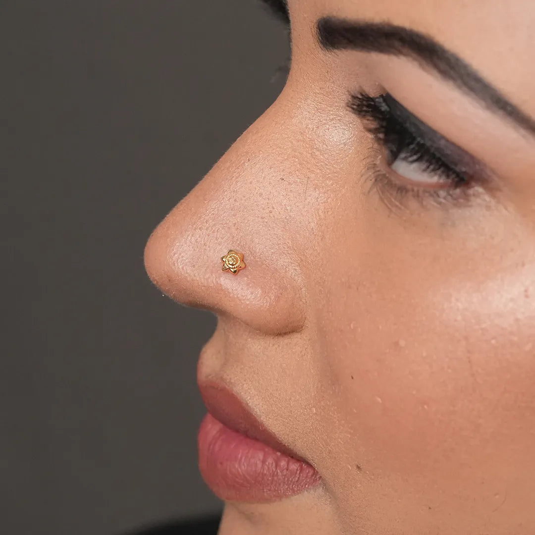 Model view of woman wearing a tiny 18K nose pin gold showcasing an elegant everyday ethnic look