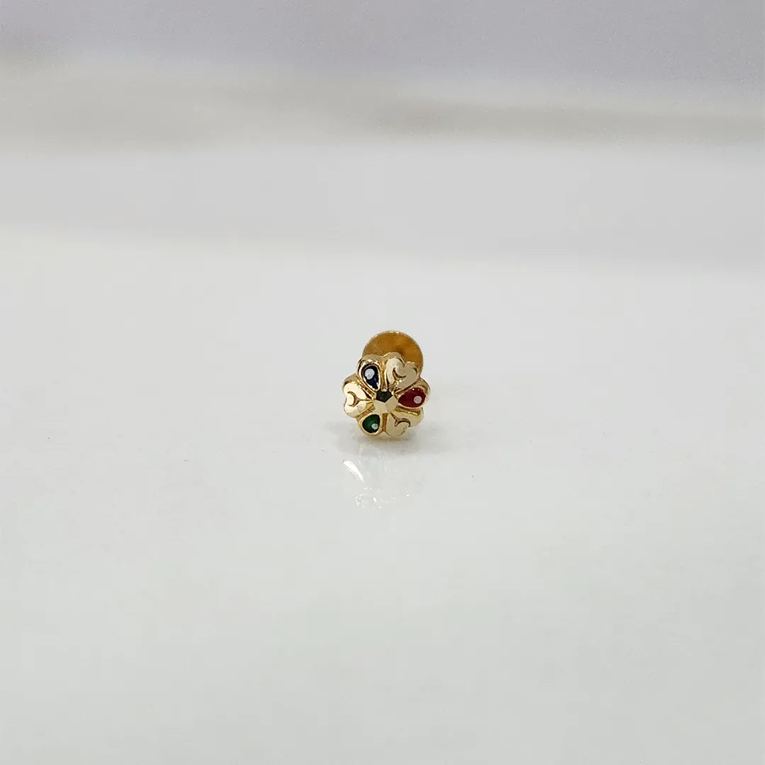 Front view of tiny multicolour 18K nose pin gold on a white background displaying its intricate detailing