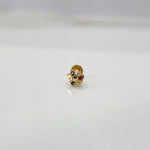 Front view of tiny multicolour 18K nose pin gold on a white background displaying its intricate detailing