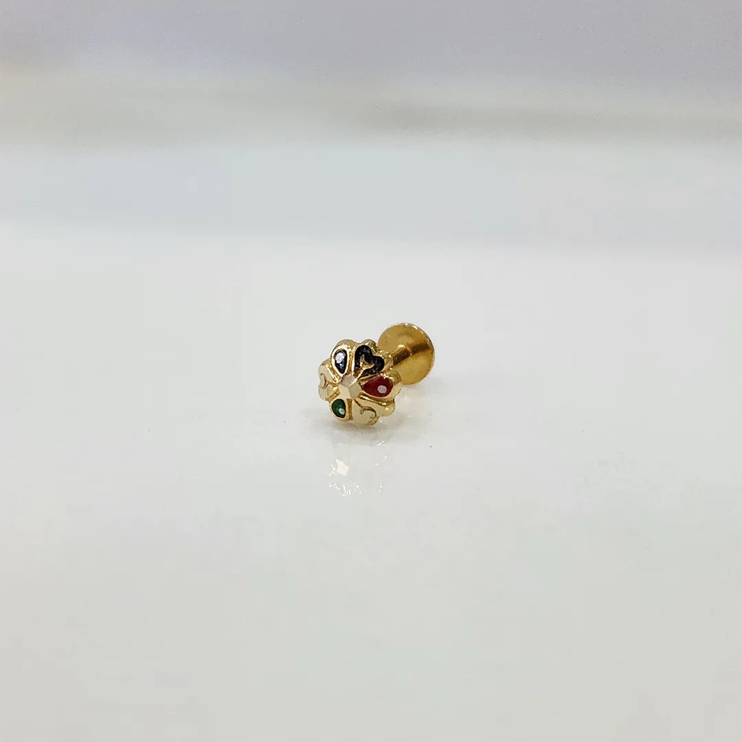 Side view of multicolour stone 18K nose pin gold placed on a white surface showing its polished finish