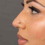 Woman wearing an elegant 18K nose pin gold showcasing a minimal and graceful everyday look