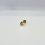 Tiny floral 18K nose pin gold placed on a clean white background showing its intricate craftsmanship