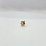 Small 18K nose pin gold placed on a white background capturing its fine handcrafted detailing