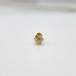 Close-up of floral 18K nose pin gold on a clean background showcasing its detailed petal structure