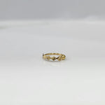 Top view of petite zigzag 18K gold nose ring laid flat on a white surface emphasizing its small size