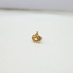 Side angle view of handcrafted 18k crescent gold nose pin design featuring traditional indian artistry