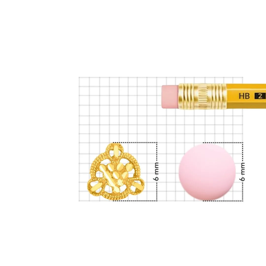 Gold nose pin displayed beside pencil for size comparison highlighting fine detailing and compact structure