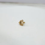 Side view of handcrafted 18k gold nose pin design with fine traditional floral texture