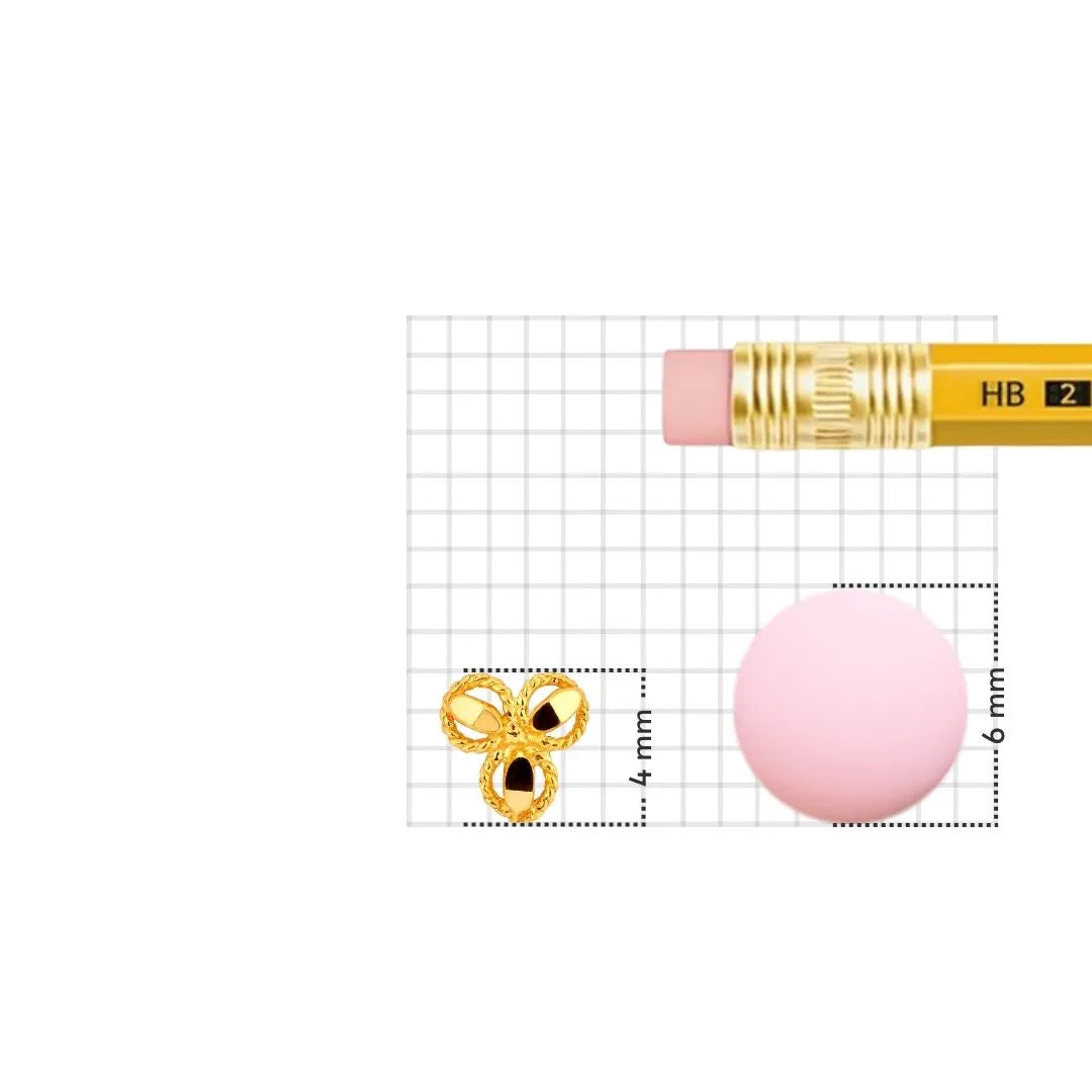 Gold nose pin displayed beside pencil for accurate size comparison featuring fine handcrafted details