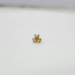 Close up of three petal gold nose pin design on white background perfect for elegant modern jewellery style