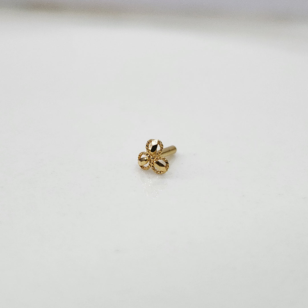 Side view of 18k three petal gold nose pin design highlighting beautiful craftsmanship and smooth polish