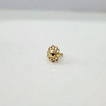 Side view of a tiny 18K nose pin gold placed on a white surface highlighting its lightweight design and smooth finish