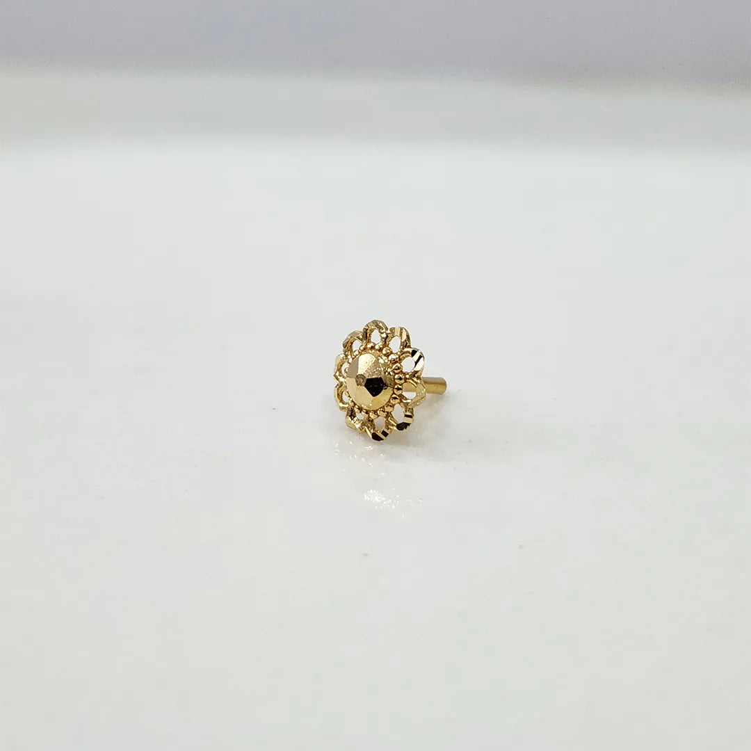 Side view of a tiny 18K nose pin gold placed on a white surface highlighting its lightweight design and smooth finish