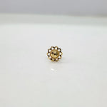 Front view of a small floral 18K nose pin gold on a white background showing compact size and fine detailing