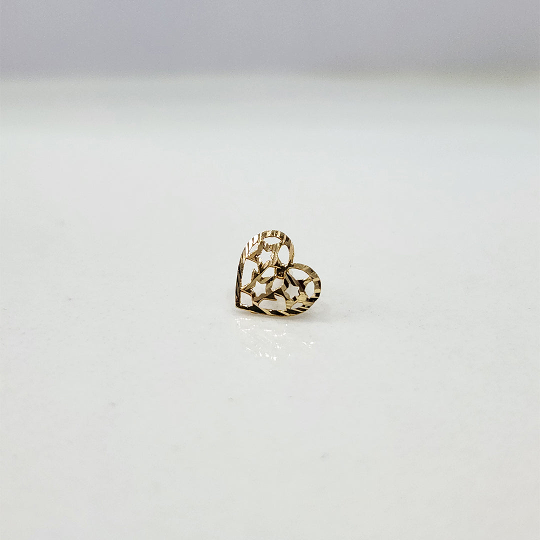 Close up of heart shaped gold nose pin design on white background perfect for women’s daily jewellery style
