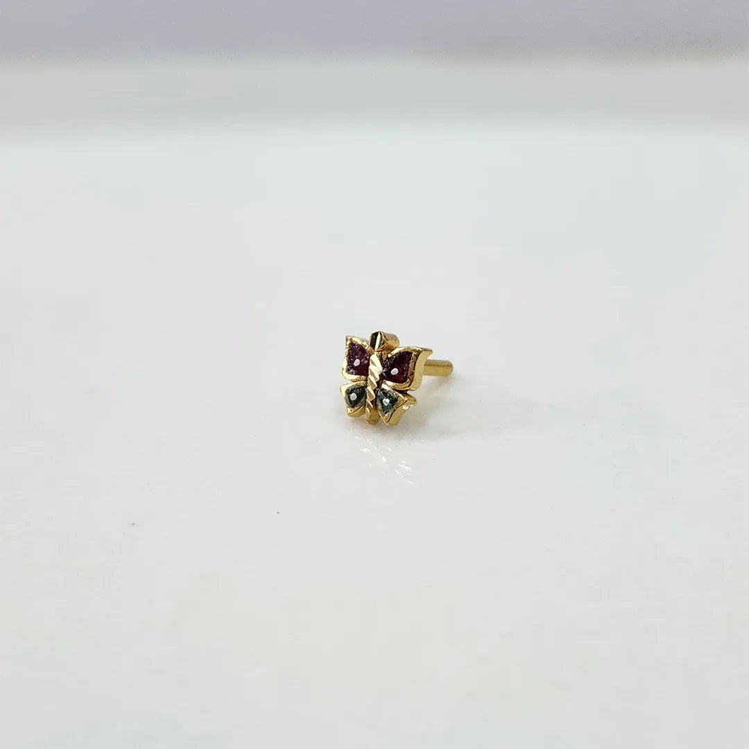 Side view of multicolour butterfly 18K gold nose pin placed on a white surface displaying its polished finish