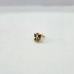 Side view of multicolour butterfly 18K gold nose pin placed on a white surface displaying its polished finish