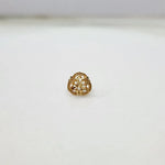 Front view of a small 18K nose pin gold on a clean white background showing its compact floral detailing